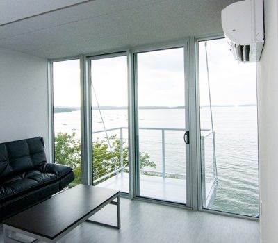 Living Room and Door to Balcony with Lake View